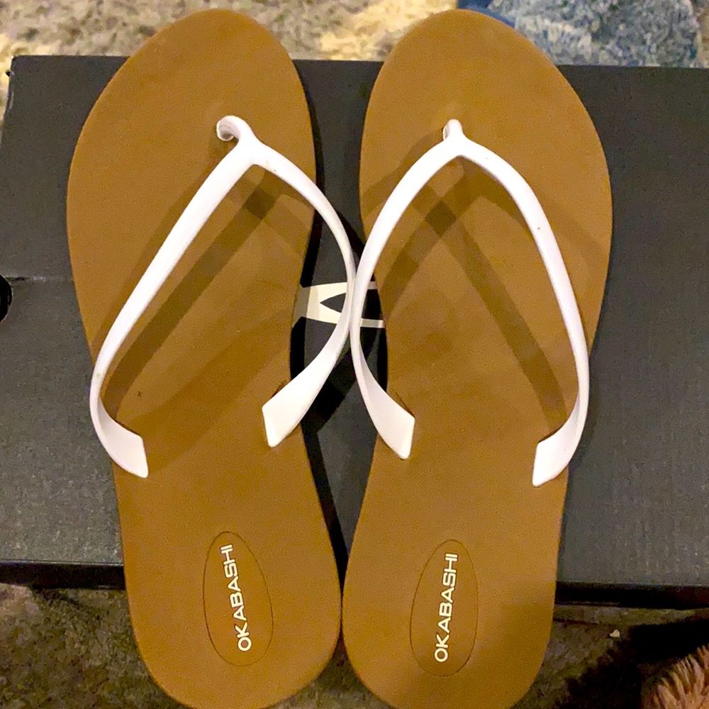 Brown and white sandals.